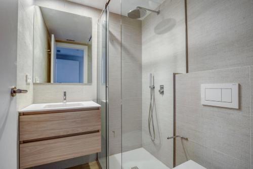 a bathroom with a shower and a sink at Blueground Sarrià doorman newly renovated BCN-119 in Barcelona