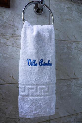 a towel with the wordsilla guimaraolis on it at Villa Asimba in Kigali