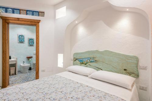 A bed or beds in a room at Terrazza e Conchiglie