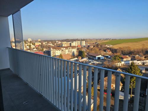 a balcony with a view of a city at Cozy Apartments Avanera Suceava in Suceava