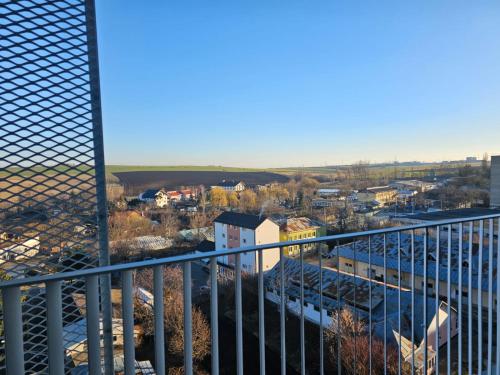 a view of a city from a balcony at Cozy Apartments Avanera Suceava in Suceava