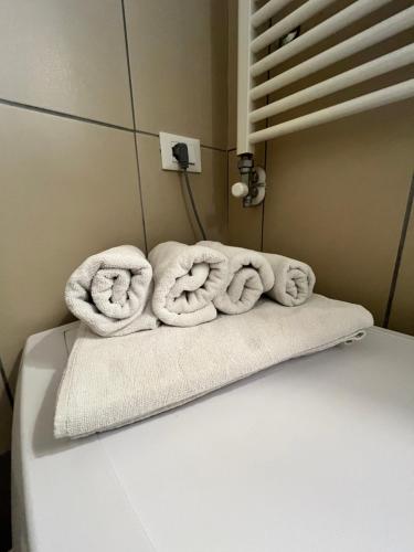 two towels sitting on top of a bed at CHIOGGIA PLAYA in Chioggia