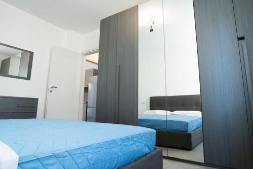 a bedroom with two beds and a mirror at [Da Lorenzo] - between station and center in Monza