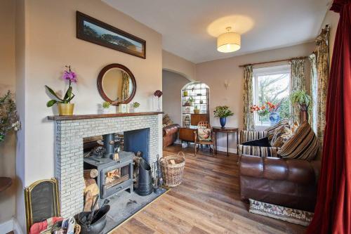 a living room with a fireplace and a couch at Host & Stay - Haigh Lodge 