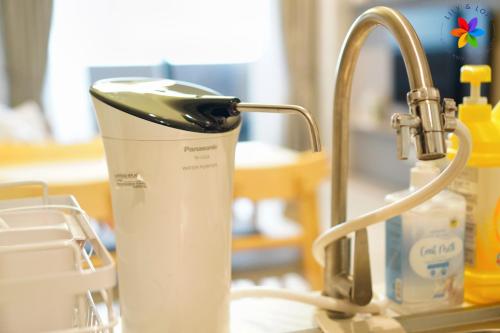 a juicer sitting on a counter next to a sink at Lumi Tropicana By LilyandLoft in Petaling Jaya