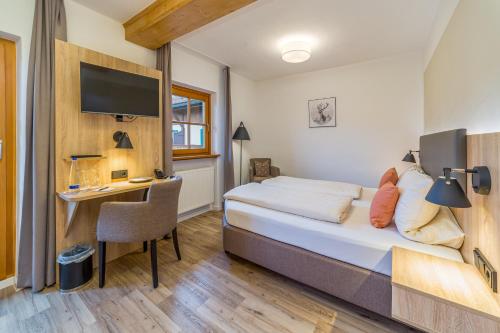 מיטה או מיטות בחדר ב-Gästehaus Linsinger