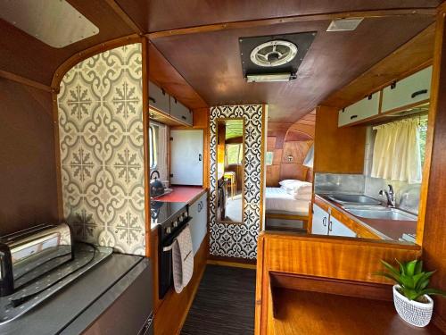 an interior view of a kitchen in a train at Retro Staycations in Ryde