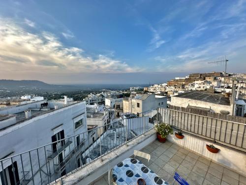 a view of a city from the balcony of a building at Casetta Giorgia in Ostuni