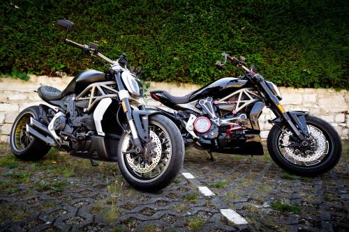 two motorcycles parked next to each other in a parking lot at Feriendorf Slawitsch in Bad Sulza