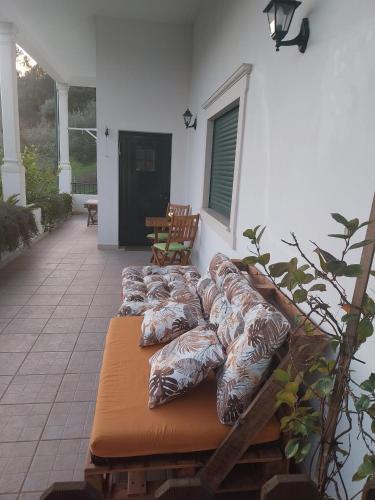 a group of pillows sitting on a patio at Abrigo do Castelo - Pica-Pau in Ourém