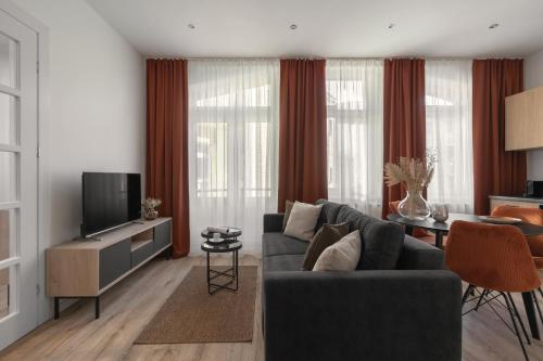 Телевизор и/или развлекательный центр в HARBOR APARTMENTS - Mickiewicza