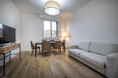 a living room with a couch and a table at YID Pietrafitta in Florence
