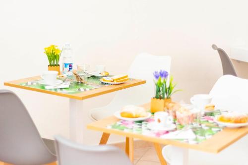 a table with plates of food on it at Casa Mian - Bed and Breakfast in Orosei