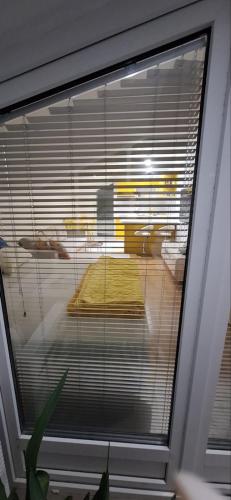 a window with a view of a table in a room at Vila Nastovski in Veles
