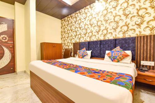 a bedroom with a bed in a room at FabHotel Spark in Jaipur