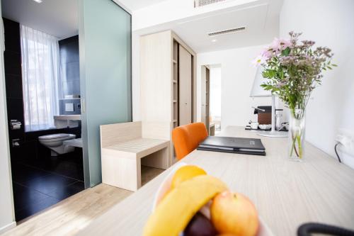 a banana sitting on a table in a room at Mercure Chur City West in Chur