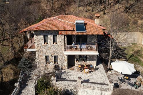 an aerial view of a stone house with a roof at Margarita's House in Kalyvia Fylaktis