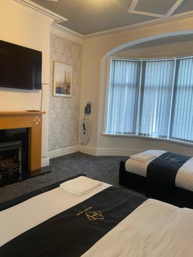Katil atau katil-katil dalam bilik di Holiday Plus - Holmfield Road