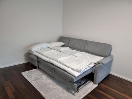 a bed sitting in the corner of a room at Apartment Amanda in Augsburg