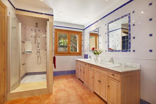 a bathroom with a shower and a sink at Villa Cab - Cala Vinyas in Cala Vinyes
