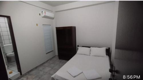 Voodi või voodid majutusasutuse Central Hotel toas