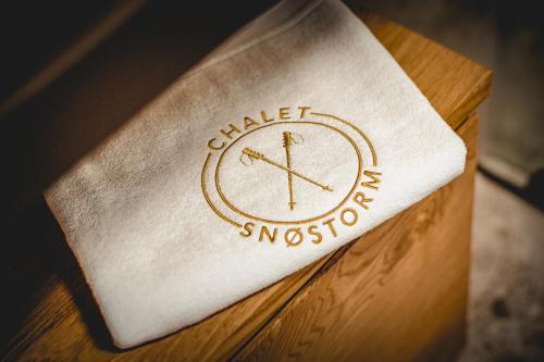 a napkin with a clock on it on a table at Chalet Snostorm in Crépin