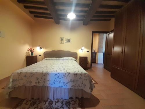 a bedroom with a large bed in a room at Casal dei Colli in Amelia