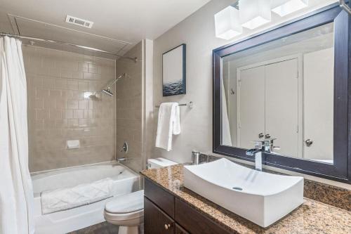 a bathroom with a sink and a tub and a toilet at Landing Modern Apartment with Amazing Amenities (ID2956X24) in Austin