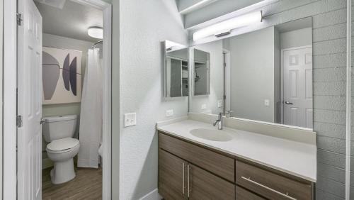 a bathroom with a sink and a toilet and a mirror at Landing Modern Apartment with Amazing Amenities (ID3931X23) in Phoenix