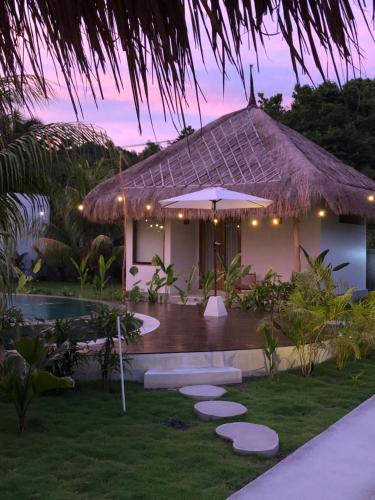 a villa with a pool and a resort at Luana Lombok in Selong Belanak