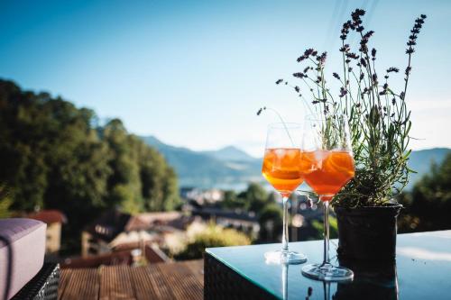 two wine glasses sitting on top of a table at Suite Franz Tegernsee in Tegernsee