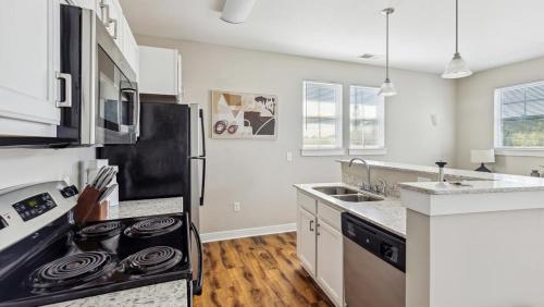 A cozinha ou cozinha compacta de Landing Modern Apartment with Amazing Amenities (ID8519X38)