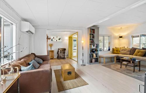 a living room with a couch and a table at Nice Home In Vig With Sauna in Vig