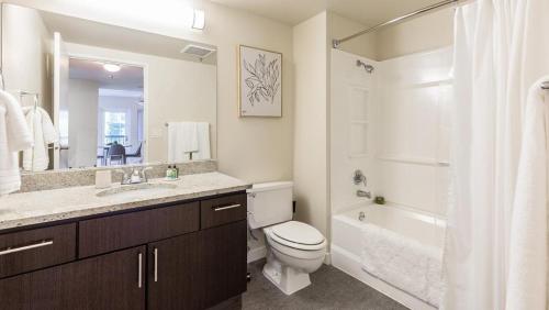 a bathroom with a toilet and a sink and a shower at Landing Modern Apartment with Amazing Amenities (ID1593X6) in Portland