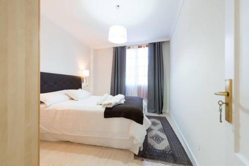 Posteľ alebo postele v izbe v ubytovaní 3 bedrooms appartement with terrace and wifi at Las Palmas de Gran Canaria 4 km away from the beach