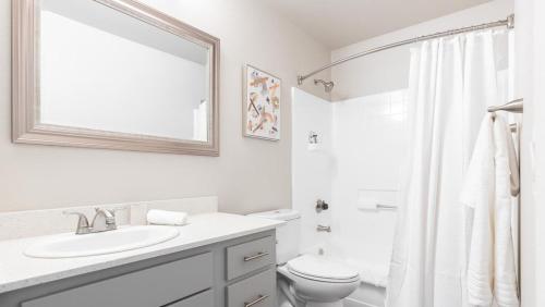 a white bathroom with a sink and a toilet at Landing Modern Apartment with Amazing Amenities (ID8102X91) in Phoenix