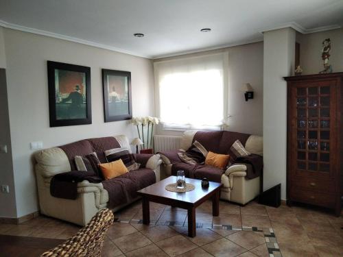 a living room with two couches and a coffee table at 3 bedrooms apartement at Bronchales in Bronchales