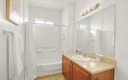 a white bathroom with a sink and a shower at Landing Modern Apartment with Amazing Amenities (ID7950X63) in Tucson