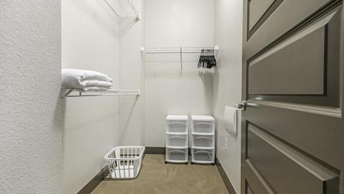 a walk in closet with a door and a towel at Landing Modern Apartment with Amazing Amenities (ID1960) in Denver