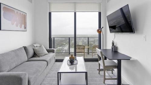 Coin salon dans l'établissement Landing Modern Apartment with Amazing Amenities (ID1398X793)