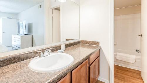 a bathroom with a sink and a mirror at Landing Modern Apartment with Amazing Amenities (ID8086X72) in Scottsdale