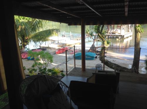 a view of a beach from a room with a window at Raiatea sur Mer in Opoa