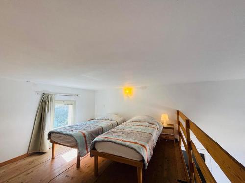 En eller flere senge i et værelse på Appartement Libeccio 41 LUMIO