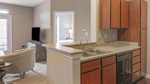 a kitchen with a sink and a counter top at Landing Modern Apartment with Amazing Amenities (ID9979X33) in Carmel