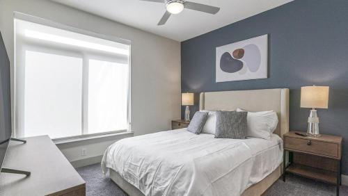 a bedroom with a large bed and a window at Landing Modern Apartment with Amazing Amenities (ID8459X09) in San Antonio
