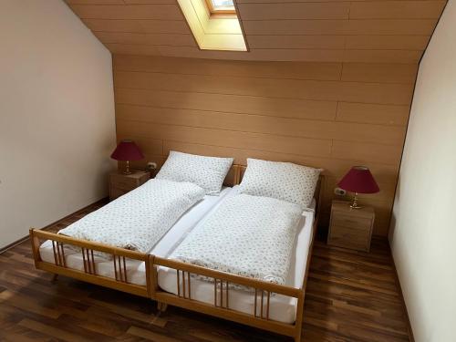 Postel nebo postele na pokoji v ubytování Haus Olympia
