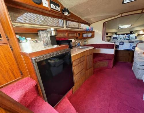 a kitchen in an rv with a sink and a counter at Private Yacht on Catskill Creek in Catskill