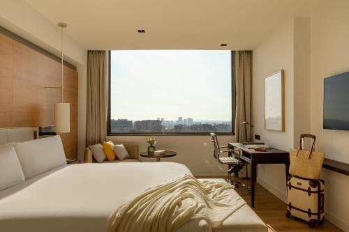 En eller flere senge i et værelse på Torre Melina, a Gran Meliá Hotel