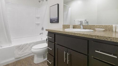 a bathroom with a sink and a toilet and a shower at Landing Modern Apartment with Amazing Amenities (ID1191X971) in Oakland