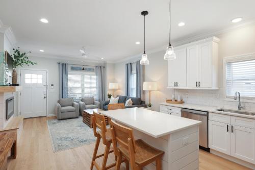 a kitchen and living room with a table and chairs at The Pelican's Perch: New Build in Seaside Heights